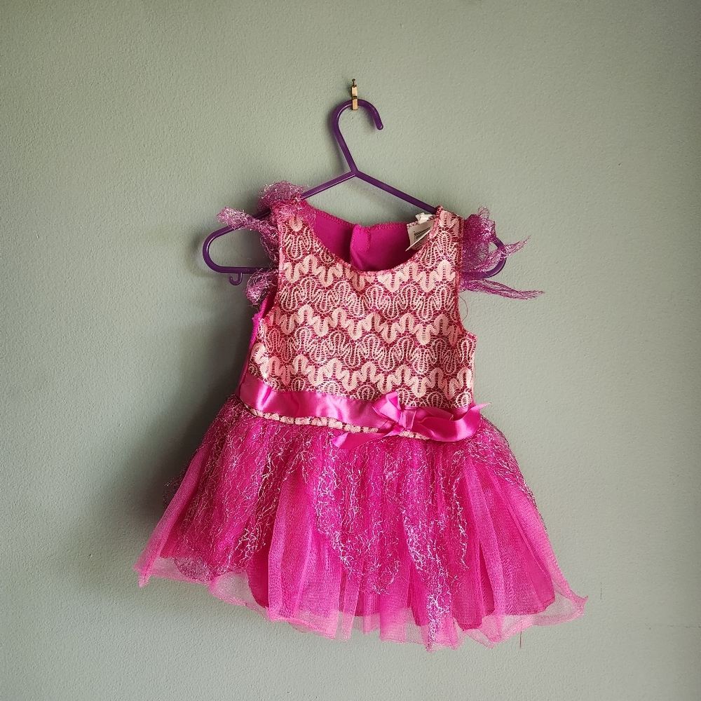 Pink sparkle fairy costume with wing attachment velcro on the back